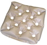 EHOB waffle cushion. A tan waffle cushion used for pressure and bed sores.