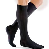 Mediven classic men's compression. Black knee-high stockings worn by a male model.