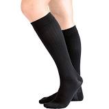 Mediven Vitality socks. Shown in knee-high black, worn by a female leg model.