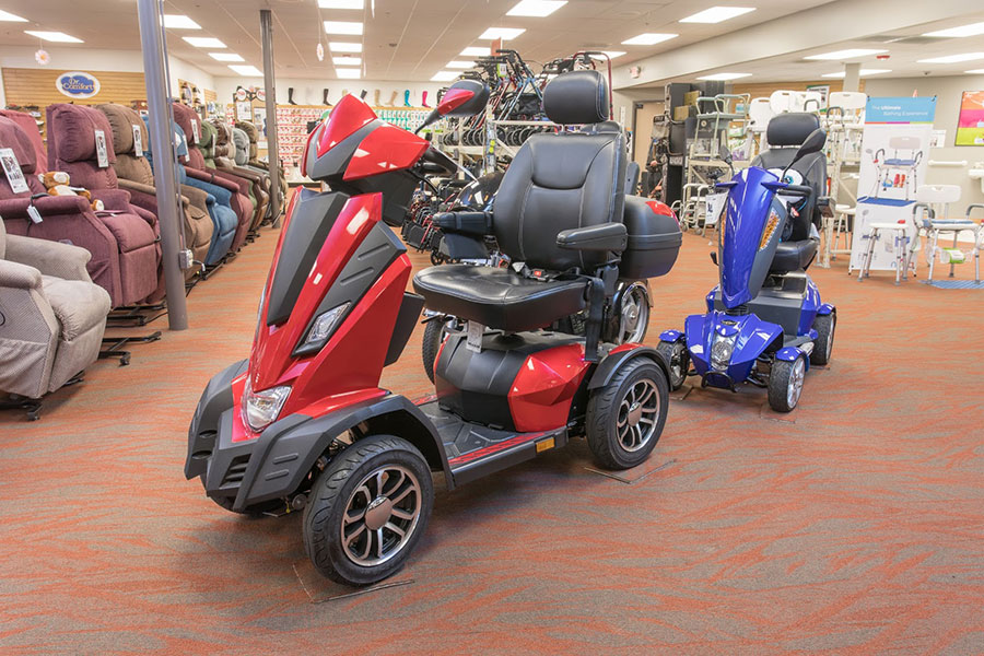 In Need of Chicago Medical Equipment featured image. The Drive King Cobra, parked on Oswald's showroom floor. Red carpeting.