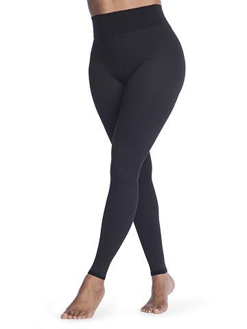 sigvaris soft silhouette leggings worn by a model. The leggings are all black and go from the ankle to the waist. White background.