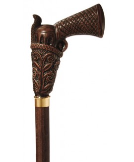 The top half of a Harvy Peacemaker Cane. The handle of the cane, which is an elaborately hand-carved peacemaker pistol in a holster, is separated from a walnut shaft by a gold ring.