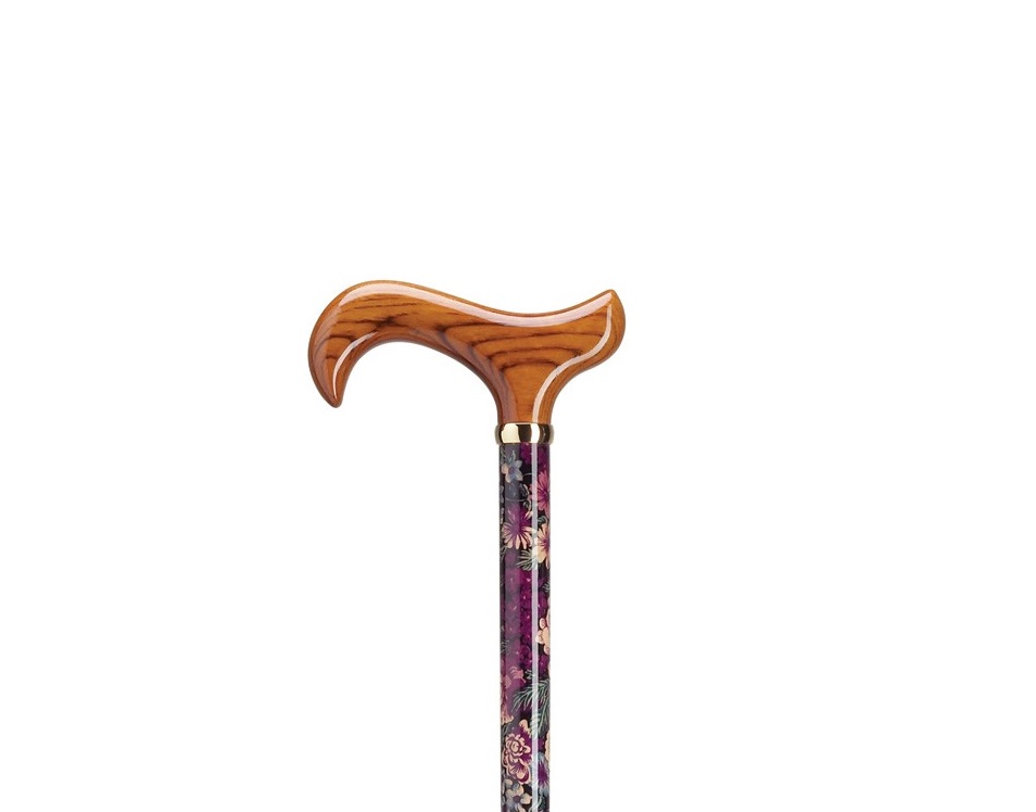 The top half of a Harvy Lavender Lace Derby Cane. Brown wood handle on a stylized lavender shaft.