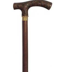 The top half of a Harvy Victorian Cane. An elaborately carved handle is separated from a walnut shaft by a gold ring.