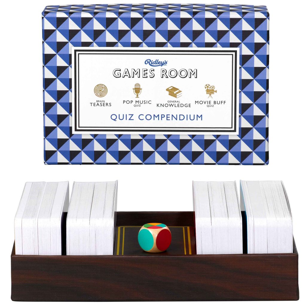 Ridley's Games Quiz Comependium. Picture shows board in fore ground, box in background. White background.