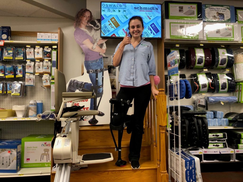 iwalk featured article staircase image. Oswald's employee Claire shows off the iWalk on the demo staircase on the Oswald's Medical Equipment Showroom Floor.