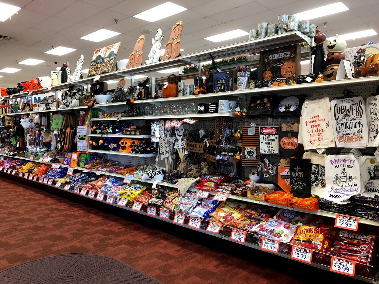 The front endcap shelves at Oswald's Pharmacy, ready for Halloween 2018. The bottom shelf is candy going on for 30 feet!