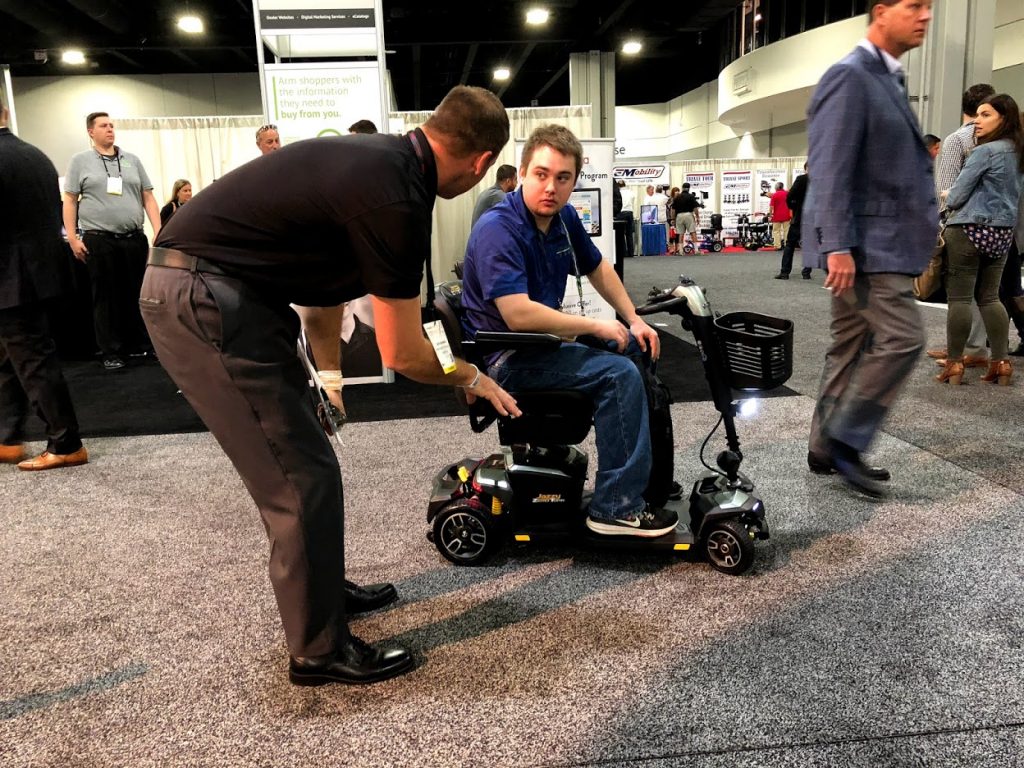 Oswald's DME manager Jerry Anderson learning about mobility scooters at a certification Seminar.
