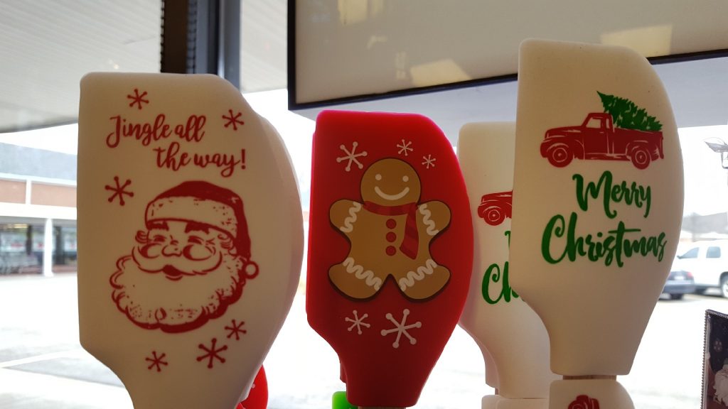 Christmas spatula styles. From left to right: Santa, Gingerbread Man, and Christmas Tree in a Truck spatula head styles.