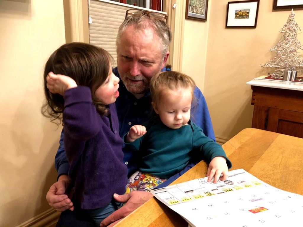 Oswald's Owner Bill Anderson sitting with his two grandchildren at home.