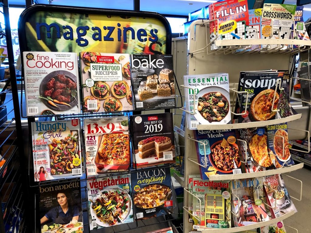 Fad Diets on magazine covers. Two magazine racks filled with healthy eating tips.