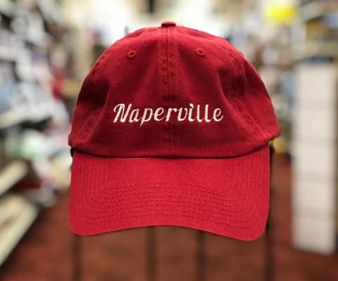 A Red Naperville baseball cap with white text.