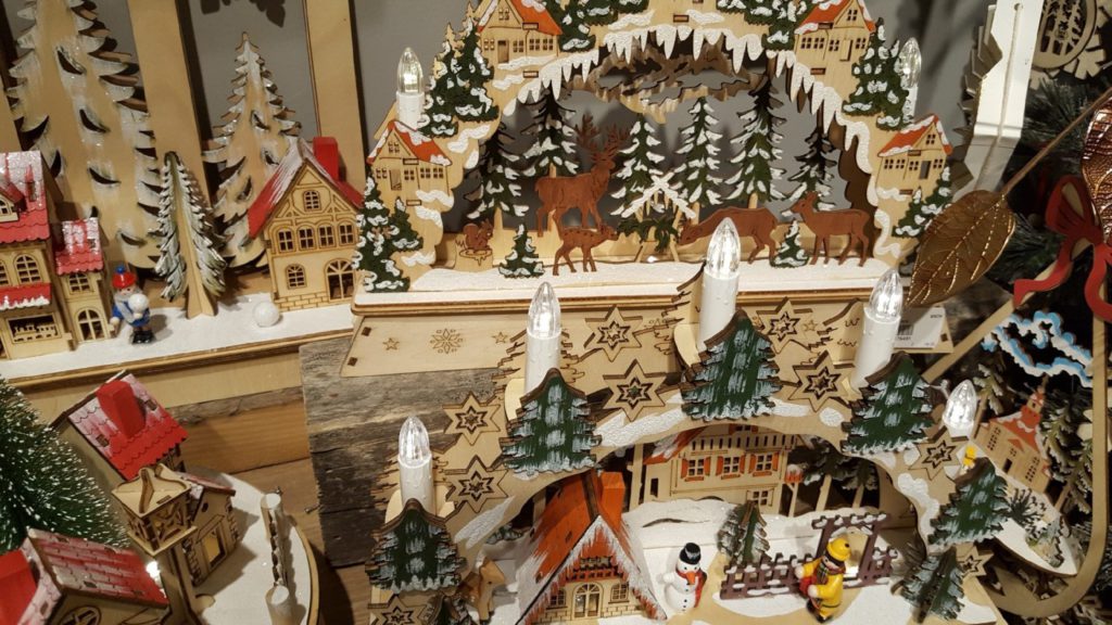 A picture of many wood cutout Christmas scenes at the 2019 Atlanta Gift Show.