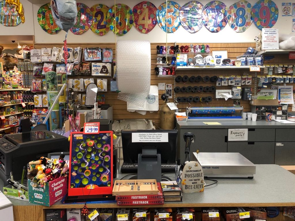 The second post office 'window' at Oswald's Post Office. Tons of birthday/holiday products can be seen behind the counter.
