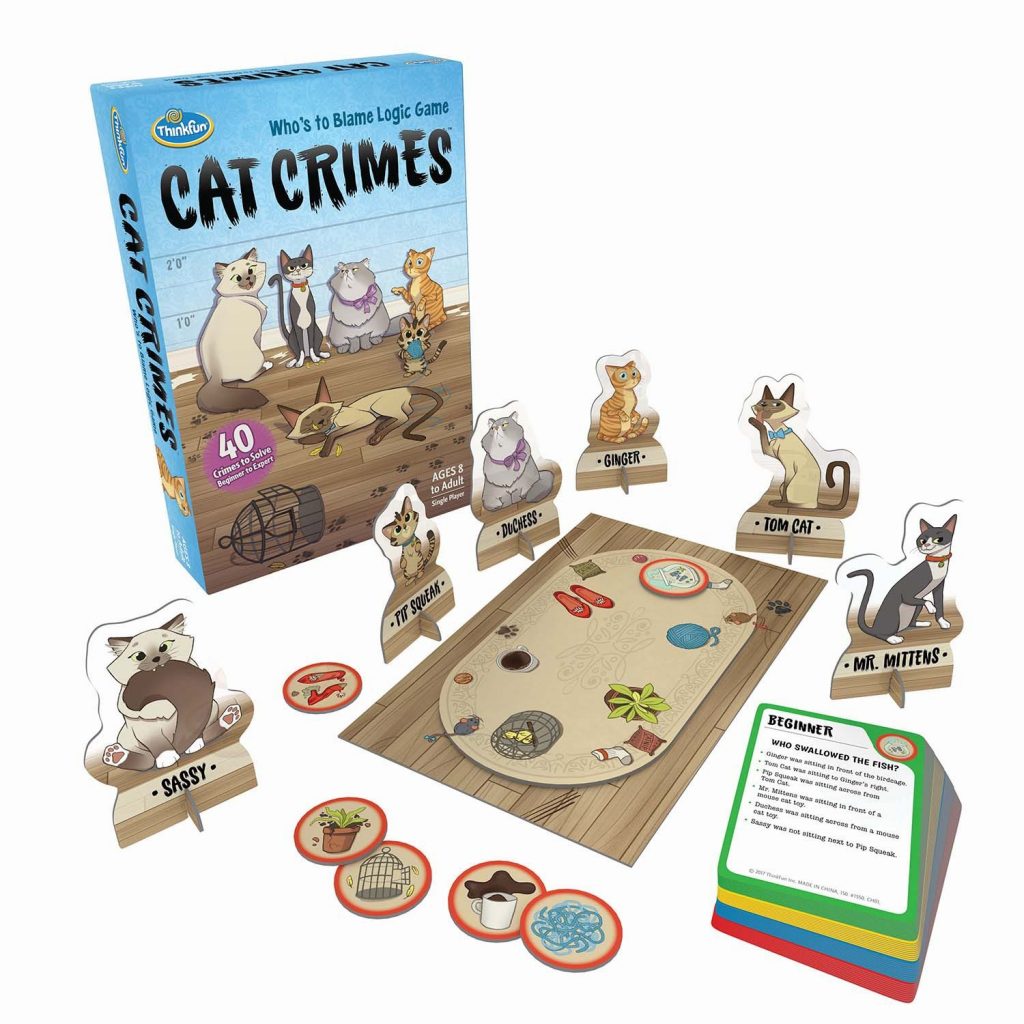 Cat Crimes Board Game. Game box is shown next to the board, cat pieces, clue pieces, and mystery deck.