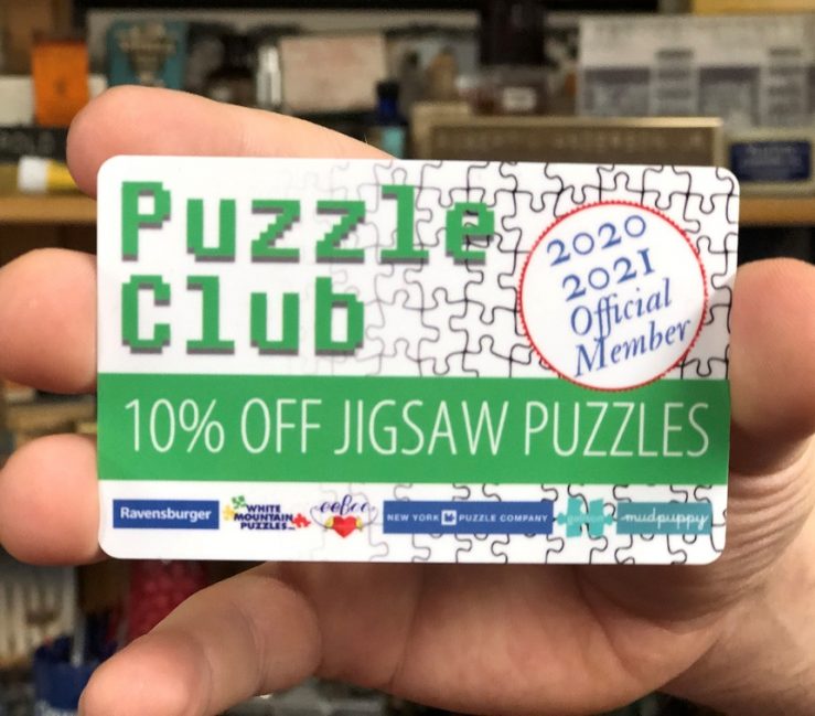 Oswald's Puzzle Club Membership Card. Image of the card, green text with blue accents over a white background.