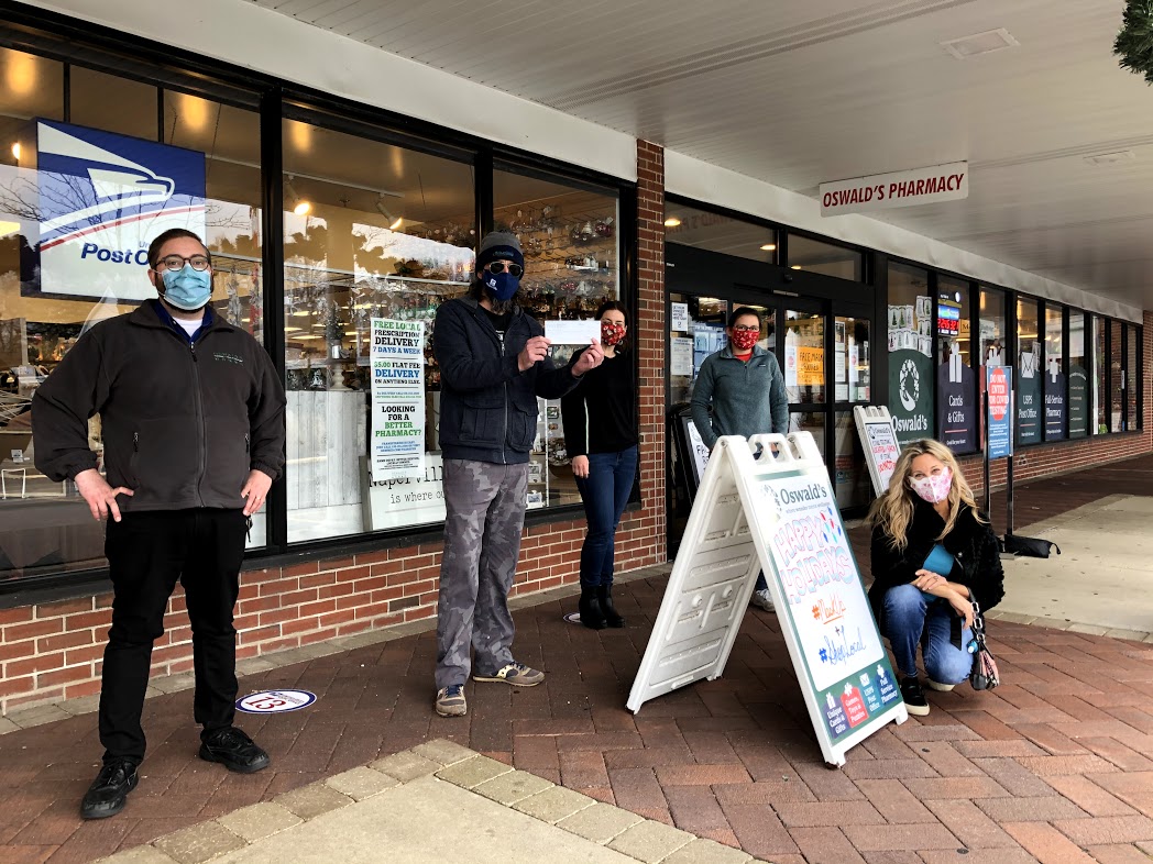 Oswald's Community Partners 2021. Image of a donation booth outside the front entrance of Oswald's Pharmacy.