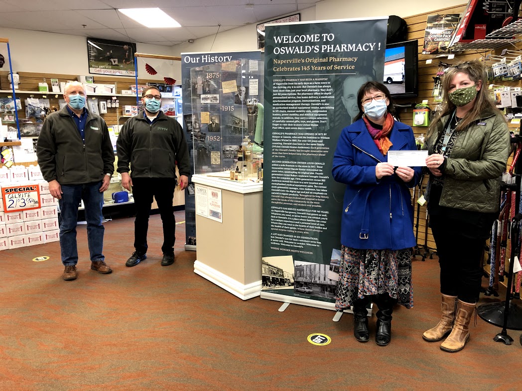 Oswald's Community Partners 2021. Image of the Naper Settlement Oswald's Pharmacy History display booth, inside the front of Oswald's Pharmacy.