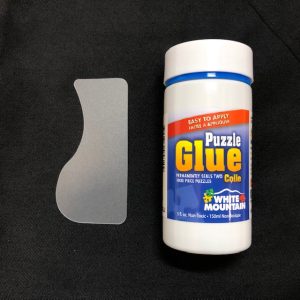 White Mountain Puzzle Glue. Image of the product packaging--5oz glue bottle.