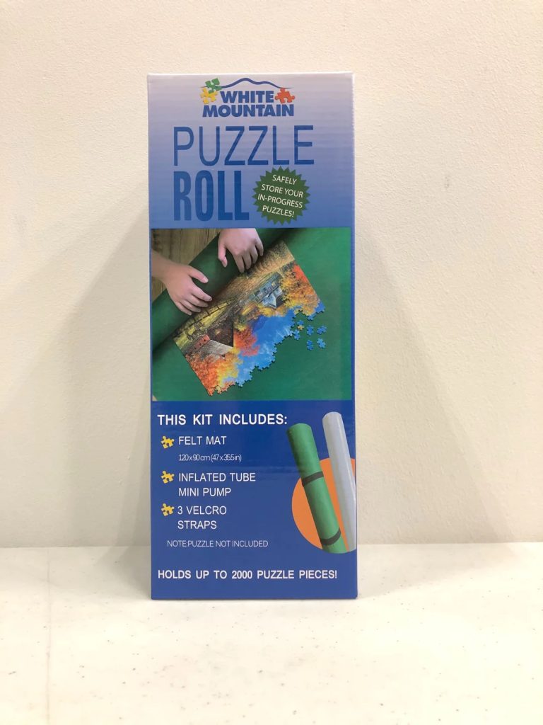 White Mountain Puzzle Roll-Up Mat. Photograph of the product packaging.