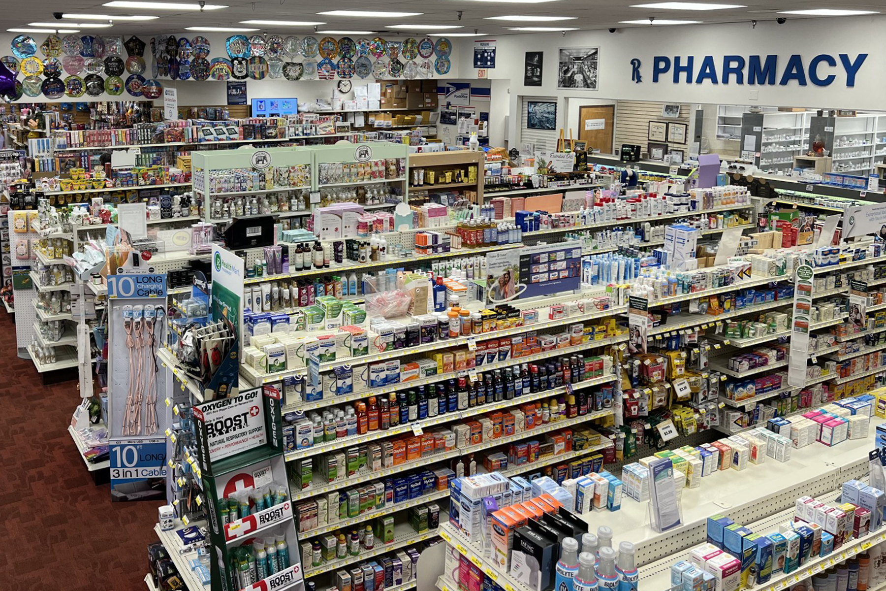 Wide view of Oswald’s Pharmacy showcasing retail products and pharmacy services