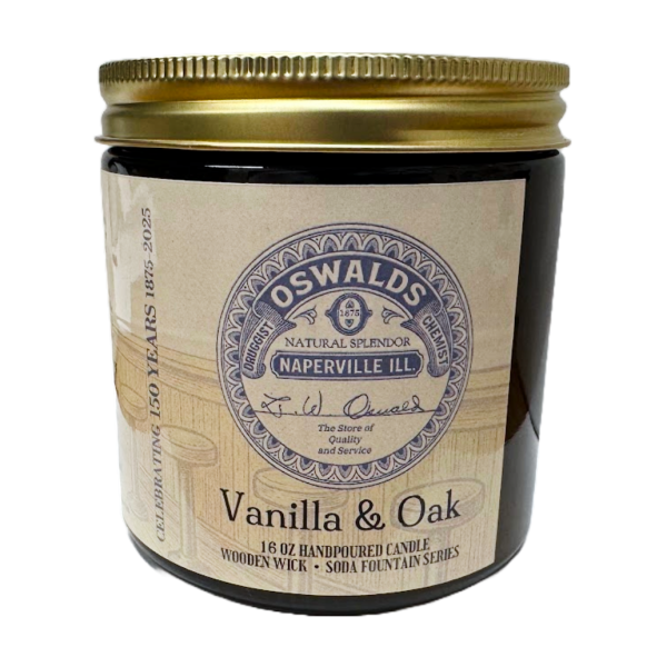 Top-down view of Oswald’s Vanilla & Oak Candle showing wooden wick inside white soy wax in amber glass jar.