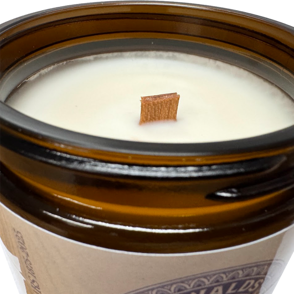 Oswald’s Vanilla & Oak handpoured soy candle in amber glass jar with gold lid and vintage pharmacy label.