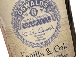 Close-up of Oswald’s Vanilla & Oak Candle label featuring vintage branding and soda fountain-inspired design.