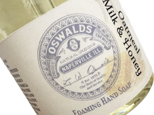 Close-up of Oswald’s Pharmacy Oatmeal Milk & Honey Foaming Hand Soap label with vintage-style apothecary branding.