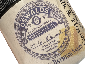 Close-up of Oswald’s Pharmacy Oatmeal Milk & Honey Aromatic Bathing Salts label featuring vintage apothecary-style branding.