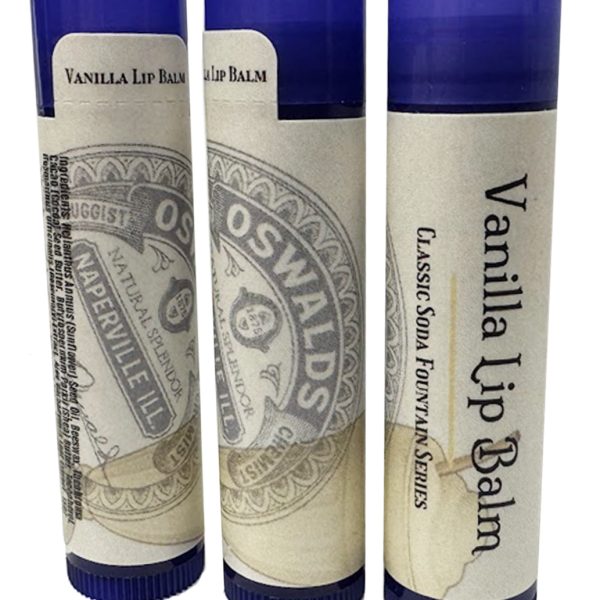 Three upright tubes of Oswald’s Vanilla Lip Balm showing front, side, and ingredient label with vintage-style branding and dark blue caps.
