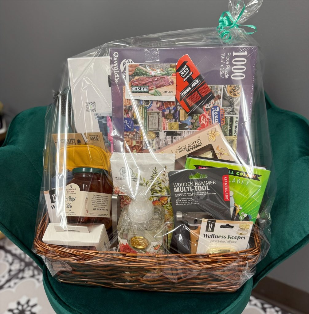 A 150th Anniversary August Giveaway gift basket filled with Oswald’s favorites, including a puzzle, gift cards, and specialty treats.
